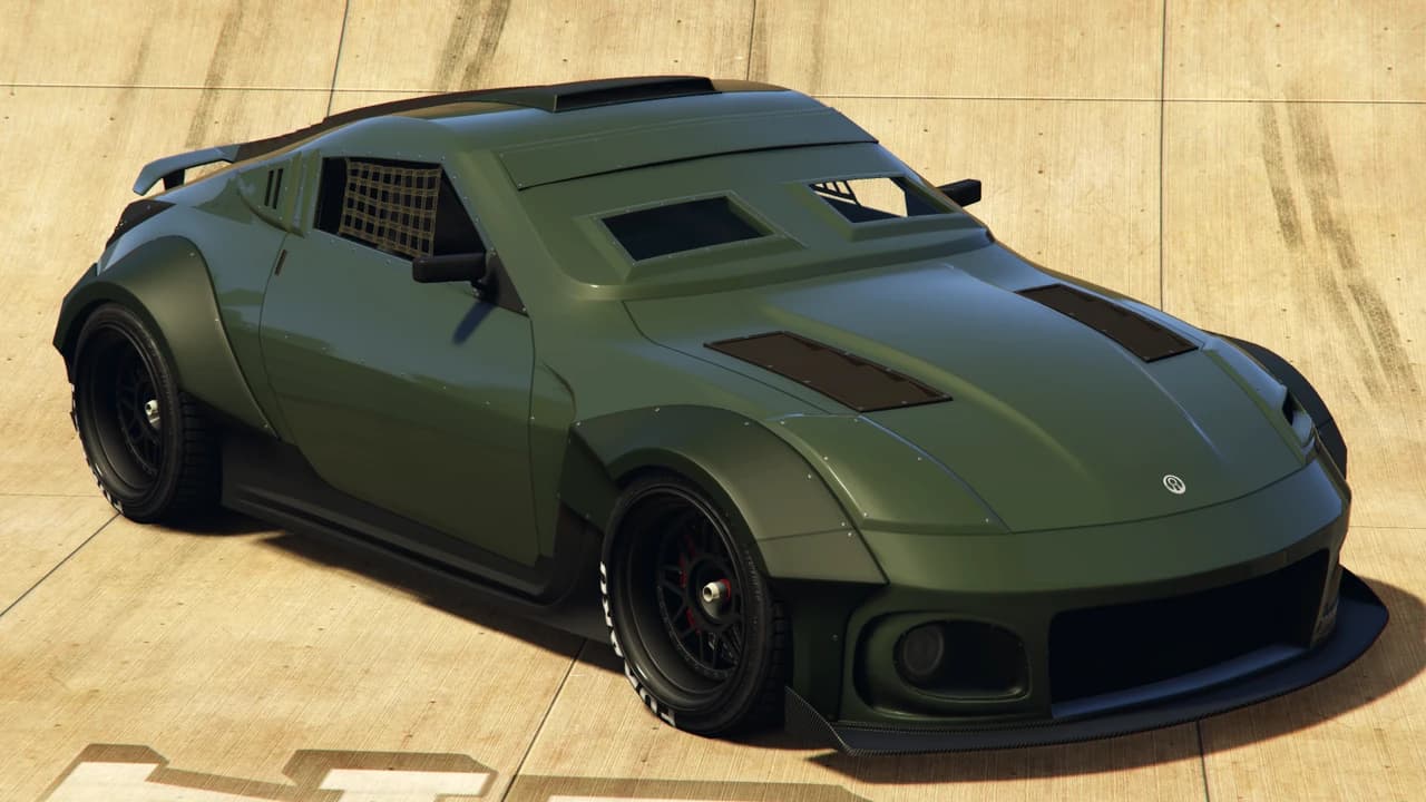 An olive green Annis Apocalypse ZR380 with riveted armour panels, front three-quarter view.