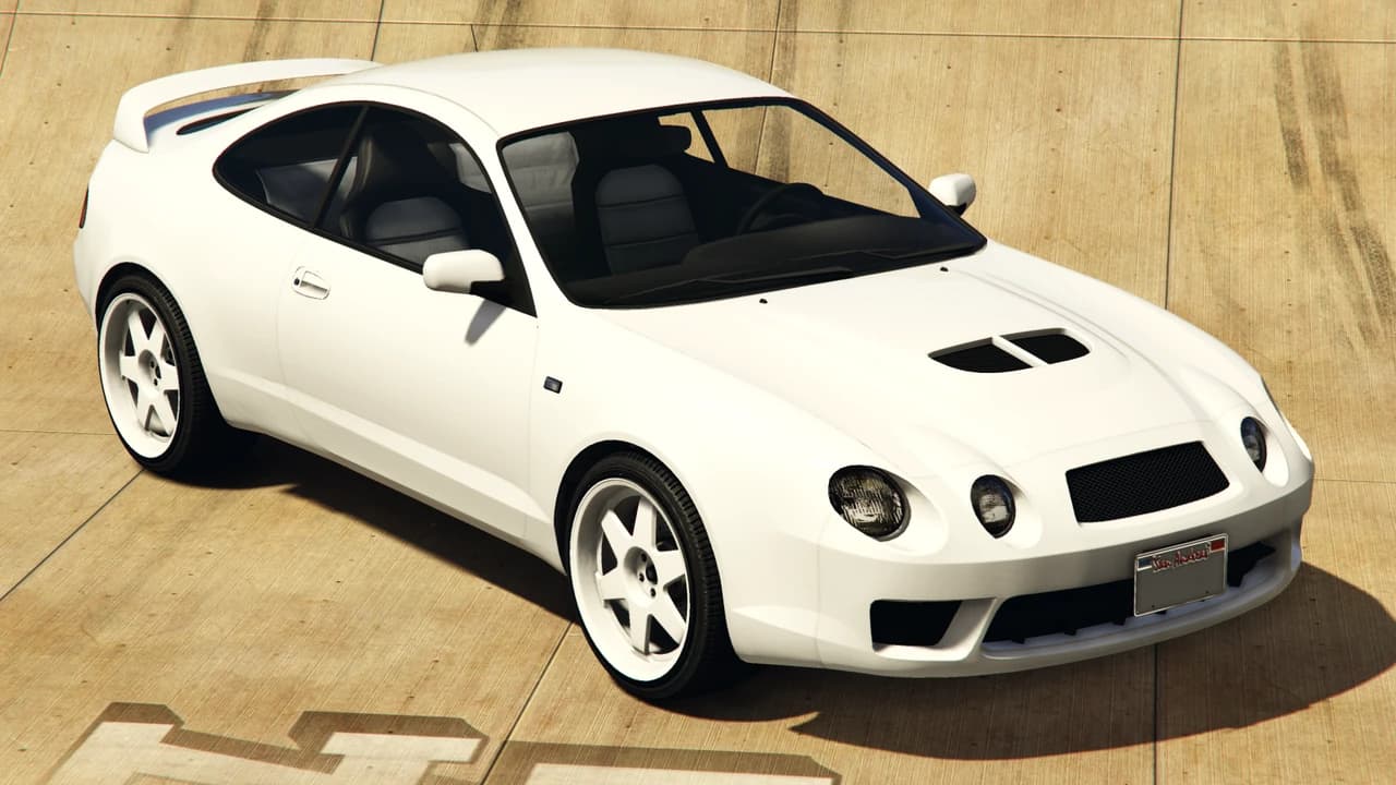 A white Karin Calico GTF with a rear spoiler, front three-quarter view.