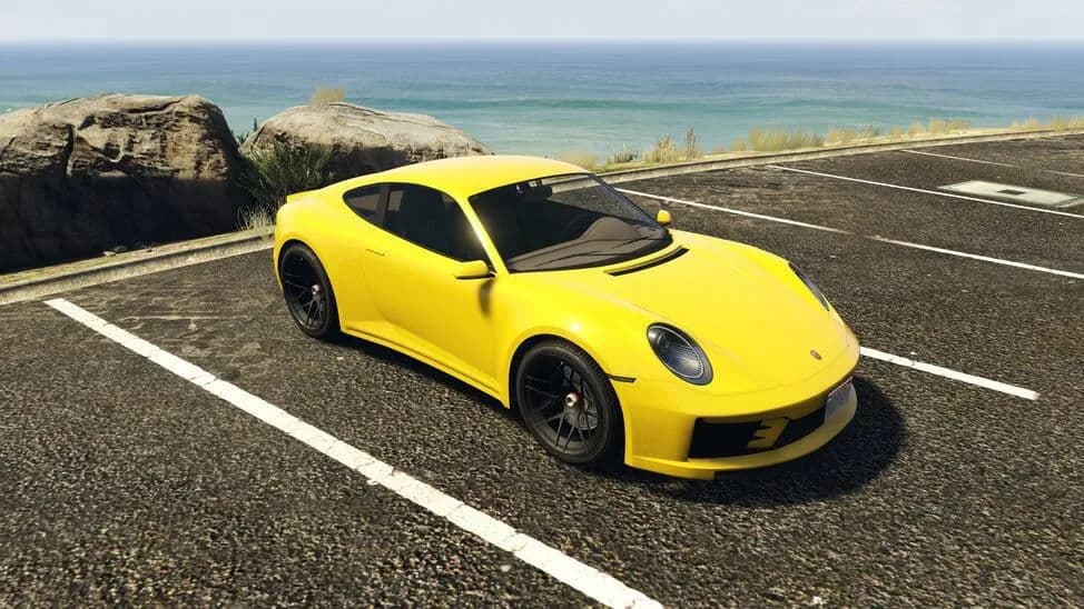The Pfister Comet S2, a yellow modern rear-engined sports coupe, parked by the coast, in GTA Online.