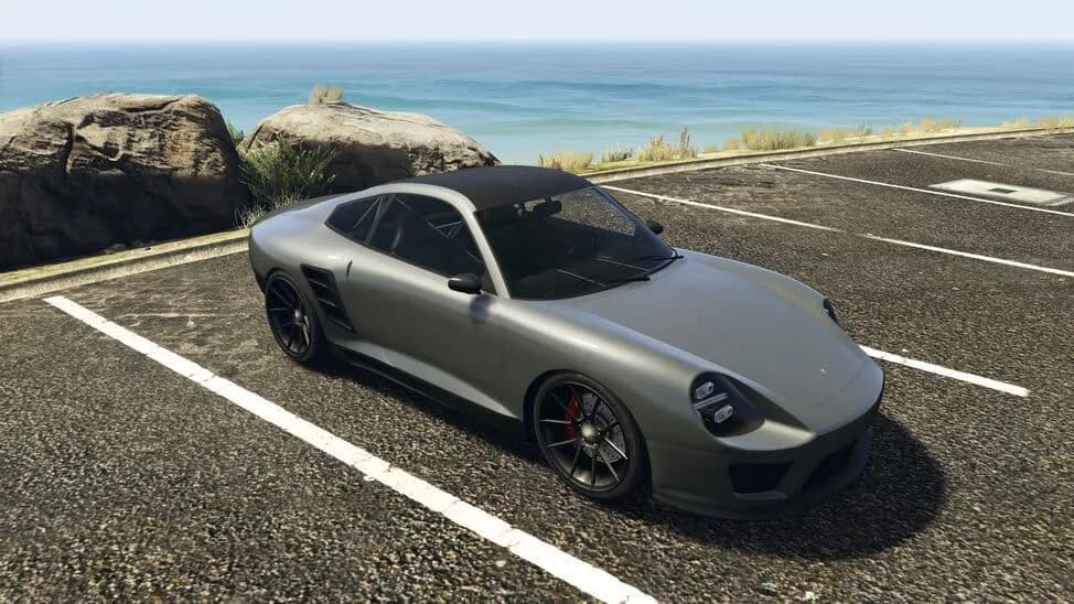 The Pfister Comet SR, a grey sports coupe with a black roof, parked by the coast, in GTA Online.