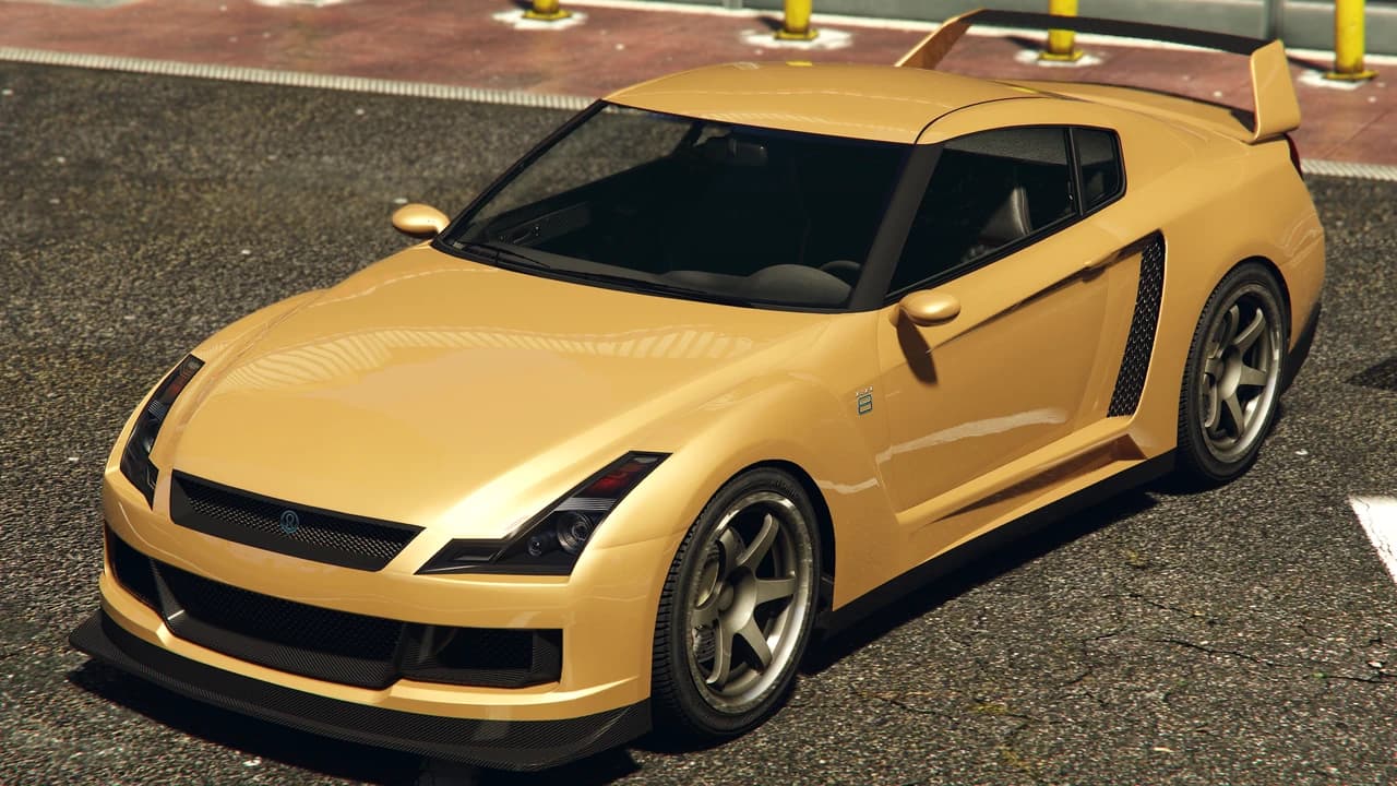 A gold Annis Elegy RH8 with a raised rear wing.