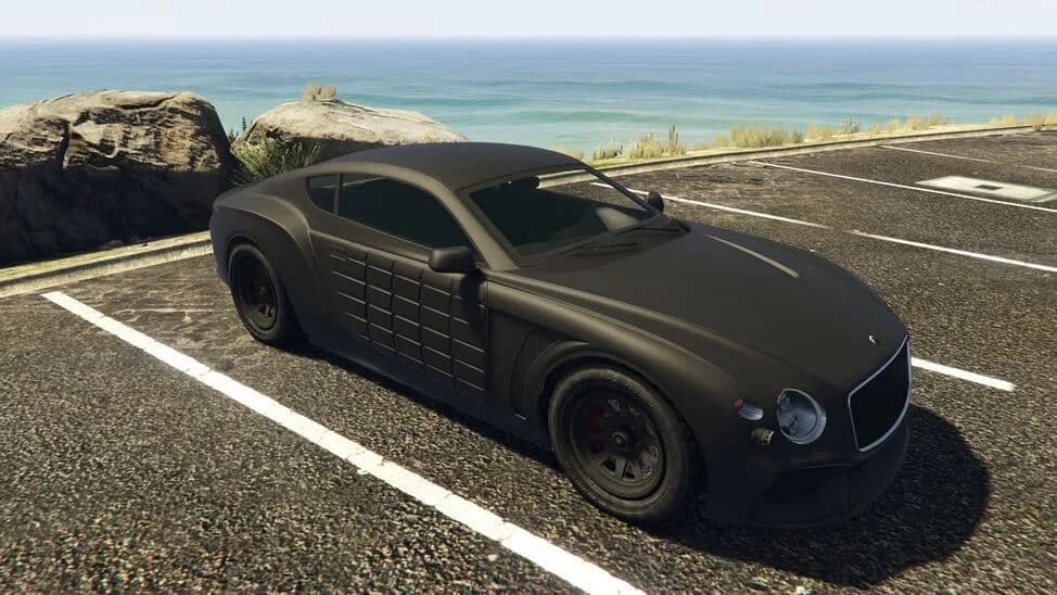 The Enus Paragon R (Armored), a matte black grand tourer with armour panels on its doors, parked by the coast, in GTA Online.
