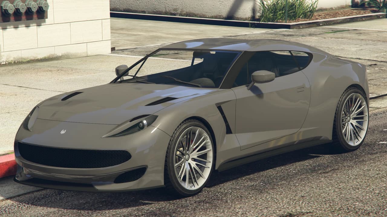 A grey Ocelot Pariah parked on a city street.