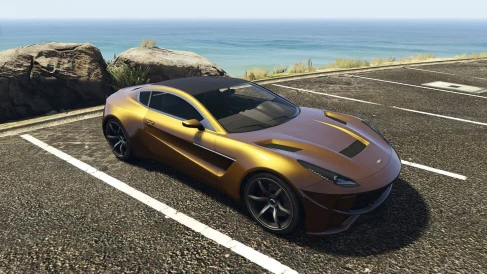The Dewbauchee Seven-70, a gold modern sports coupe with a black roof, parked by the coast, in GTA Online.