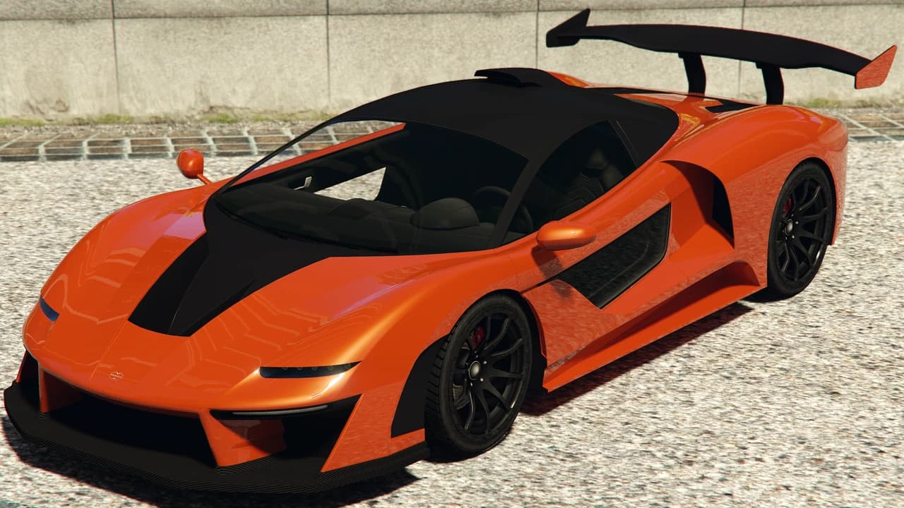 An orange Progen Emerus with a black roof and a swan-neck rear wing, front three-quarter view.
