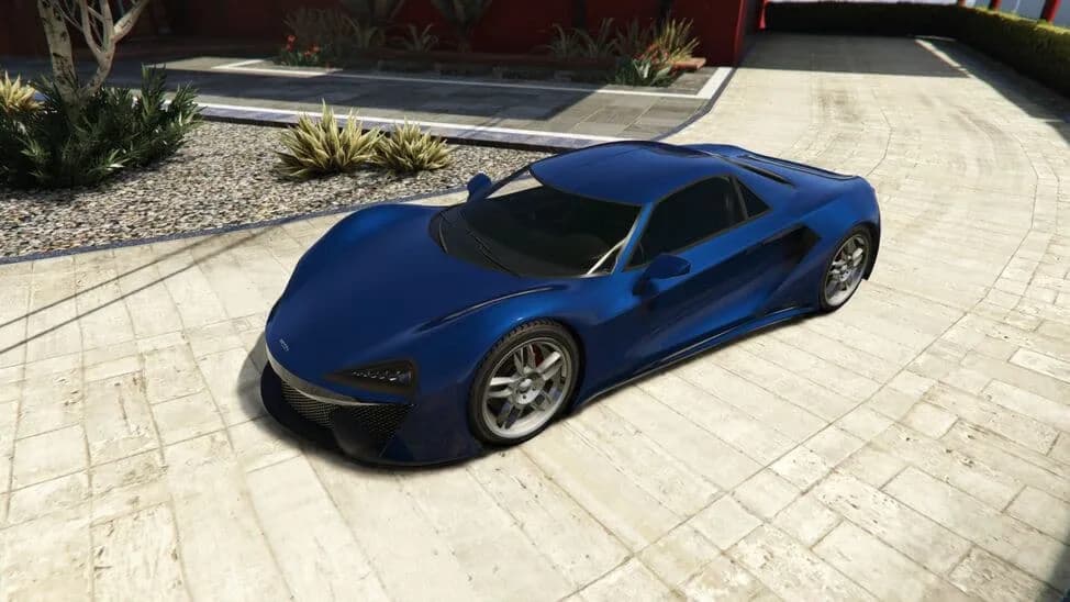 The Progen Itali GTB, a blue mid-engined supercar, parked on a paved courtyard, in GTA Online.