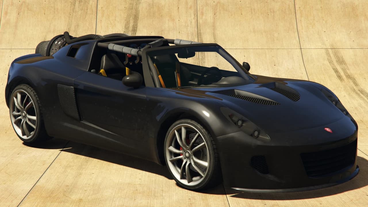 A black Coil Rocket Voltic with an exposed roll cage and a rear-mounted rocket booster, front three-quarter view.