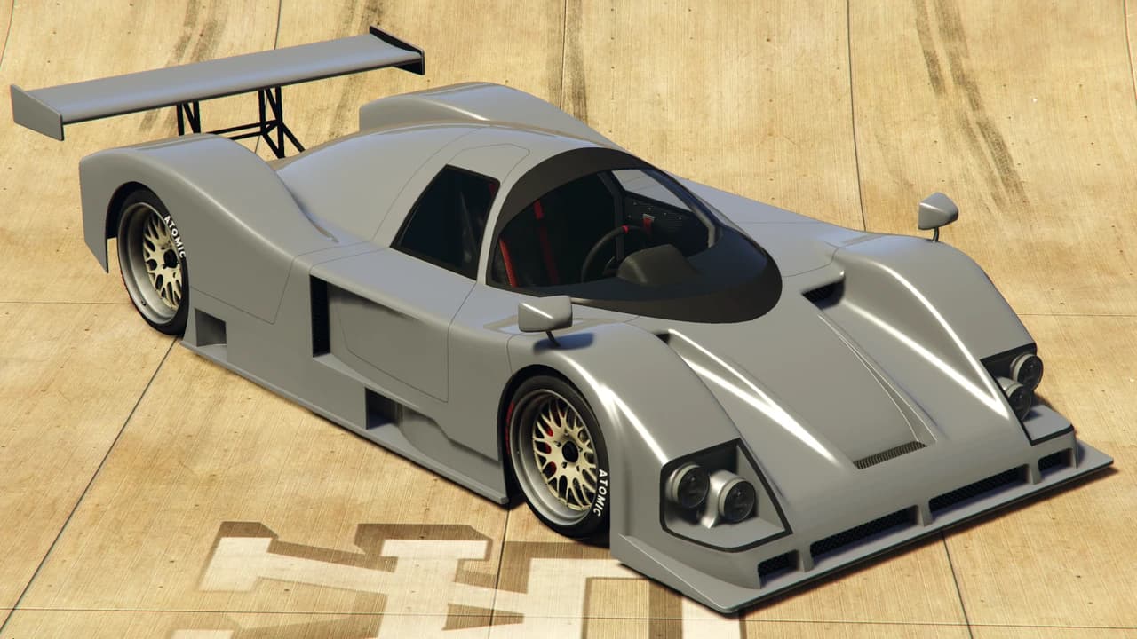 A grey Annis S80RR prototype racer with a high strut-mounted rear wing, front three-quarter view.