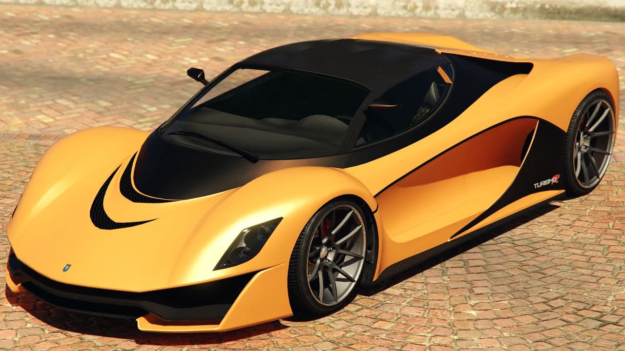 An orange Grotti Turismo R with a black carbon roof, front three-quarter view.