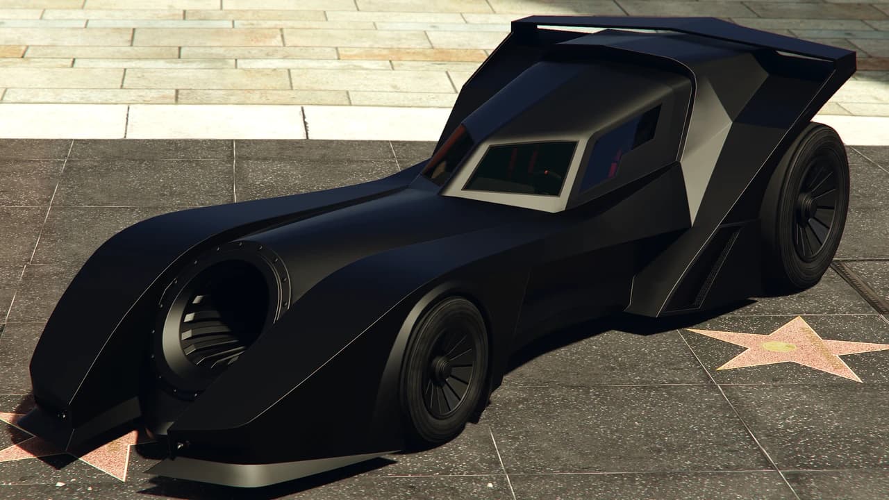A black Vigilante, a jet-powered two-seater with a canopy cockpit, front three-quarter view.