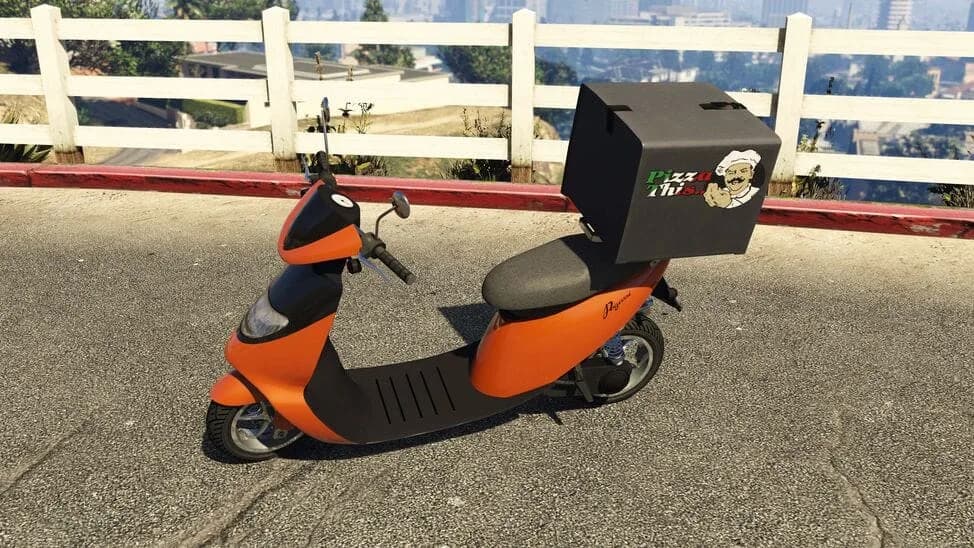 The Pegassi Pizza Boy, an orange delivery scooter with a pizza box on the back, parked by a white fence, in GTA Online.