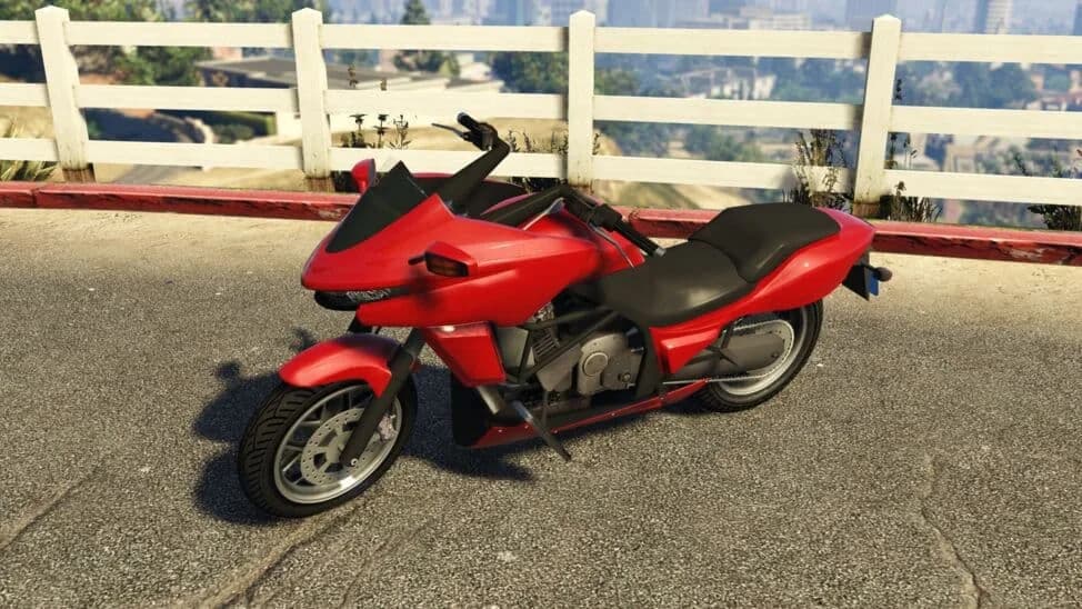 The Dinka Thrust, a red sport-touring motorcycle, parked by a white fence, in GTA Online.