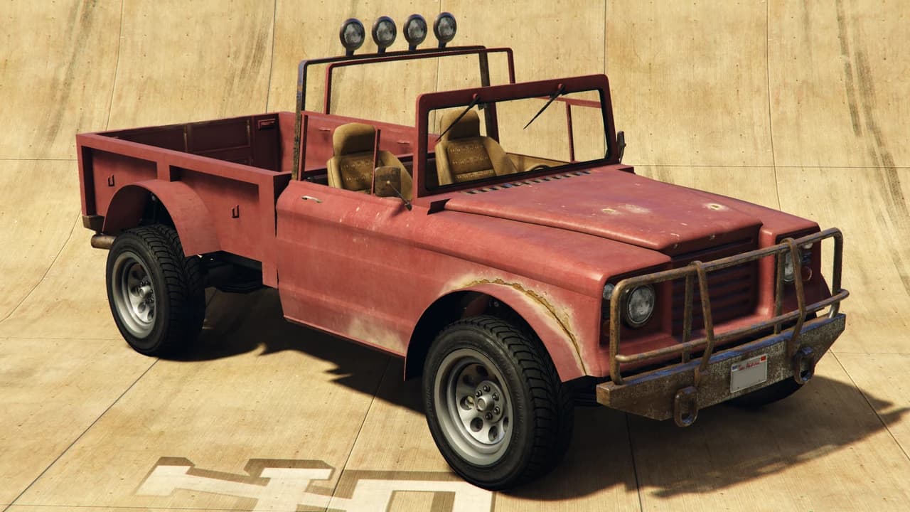 A faded red Canis Bodhi, an open-topped pickup with a roll bar and roof-mounted lamps, front three-quarter view.