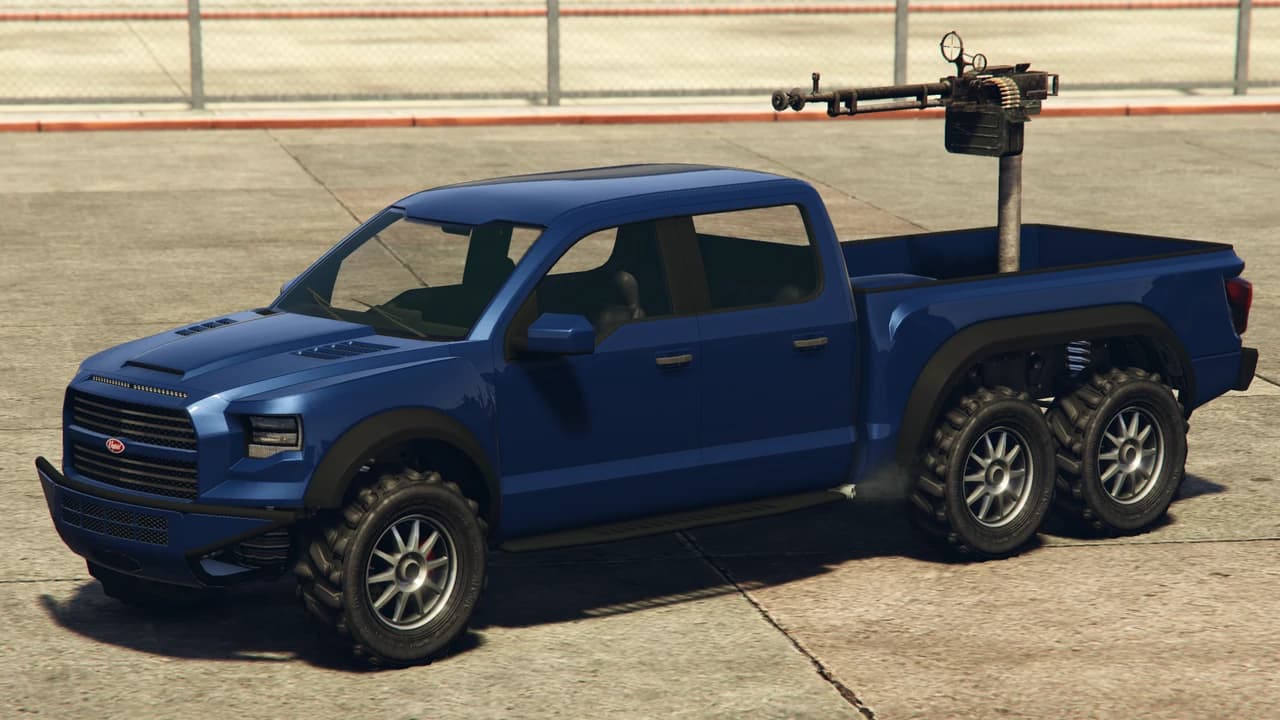 A blue Vapid Caracara, a six-wheel pickup with a mounted machine gun in the bed, front three-quarter view.