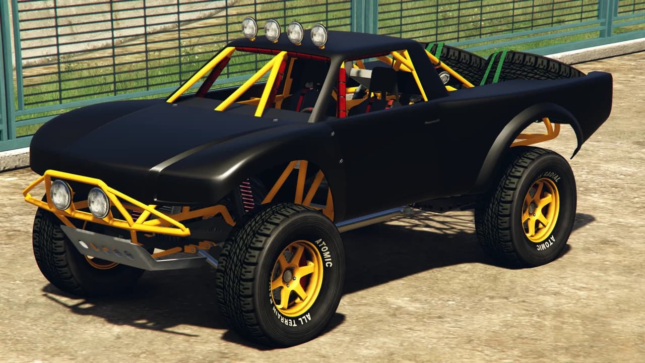 A black Vapid Trophy Truck with a yellow exposed roll cage and off-road tyres.