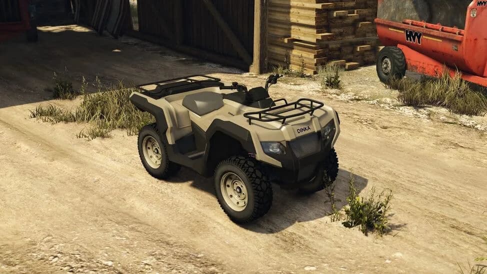 The Dinka Verus, a tan four-wheeled quad bike with luggage racks, parked by a barn, in GTA Online.