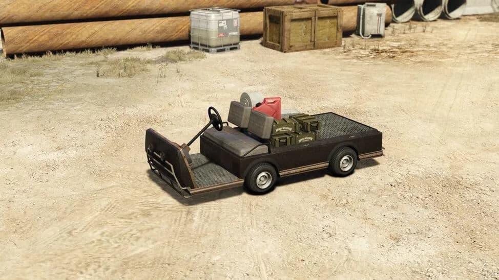 The Caddy (Bunker), a weathered utility golf cart with a flat cargo bed of supplies, parked on a dirt yard, in GTA Online.