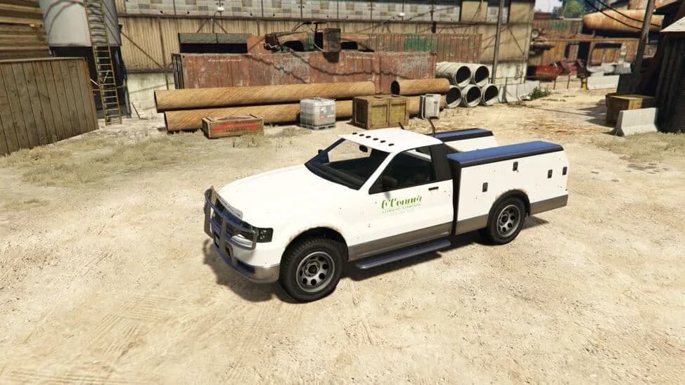 The Utility Truck (Contender), a white pickup with a utility service body and a bull bar, parked in a yard, in GTA Online.