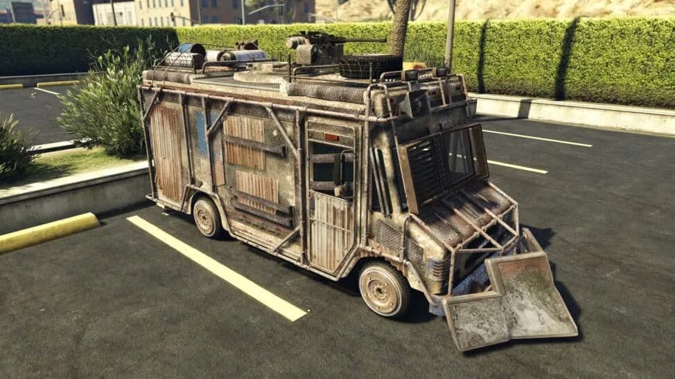 The Armored Boxville, a rusted delivery van covered in welded armour plates with a roof turret, parked in a car park, in GTA Online.