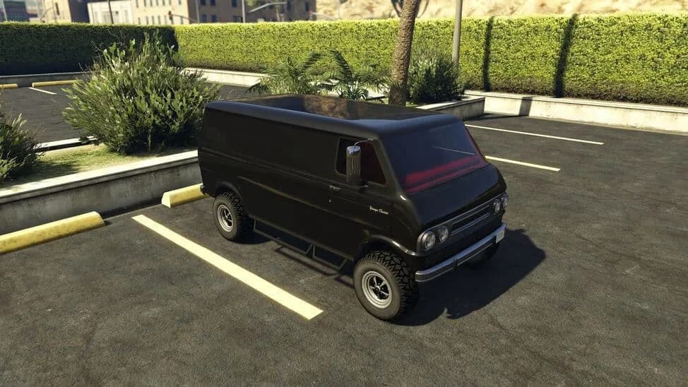 The Bravado Youga Classic 4x4, a black lifted 1970s van on off-road tyres, parked in a car park, in GTA Online.