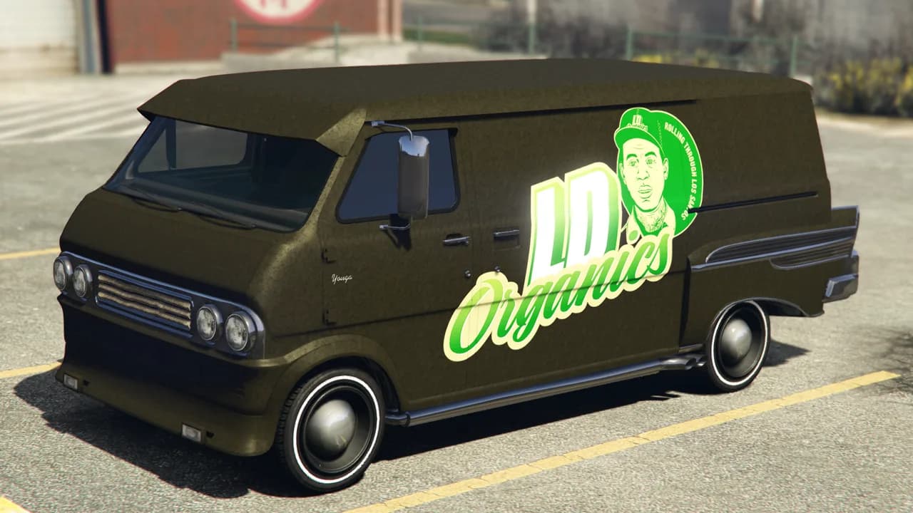 The Vapid Youga Custom, an olive 1970s van in a cannabis-brand livery with whitewall tyres, parked in a car park, in GTA Online.