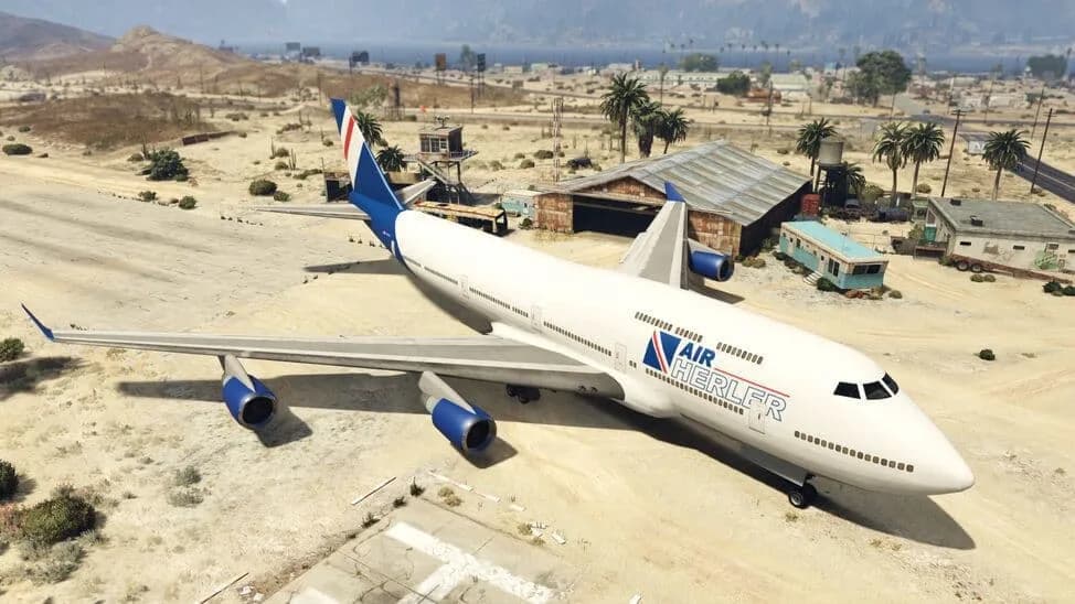 The Jet, a white four-engined airliner in an airline livery, parked on a desert airfield, in GTA Online.