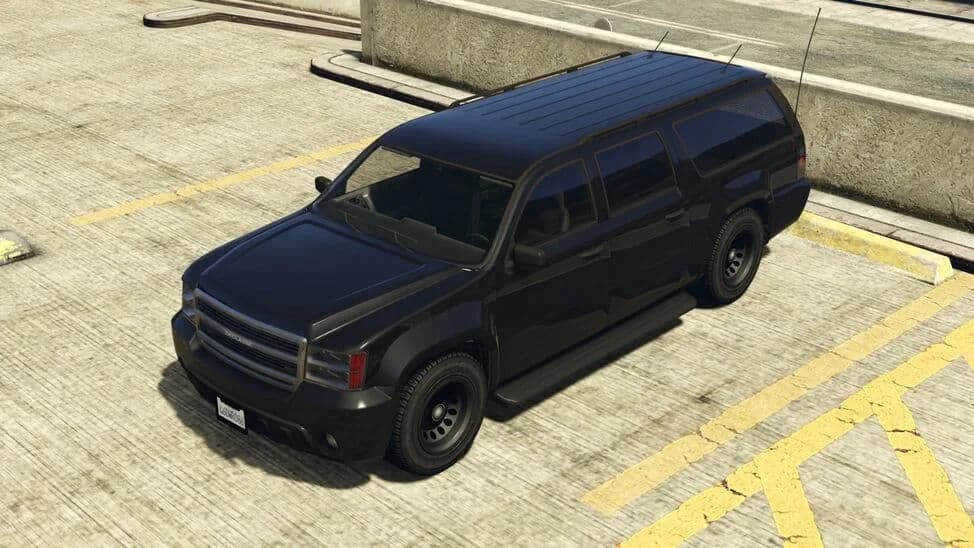 The FIB Granger, a black unmarked full-size federal SUV, parked on a rooftop car park, in GTA Online.