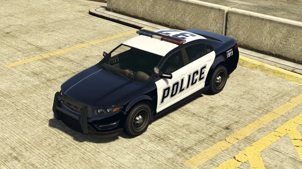 The Police Cruiser (Interceptor), a black and white police saloon with a light bar and push bar, parked on a rooftop car park, in GTA Online.