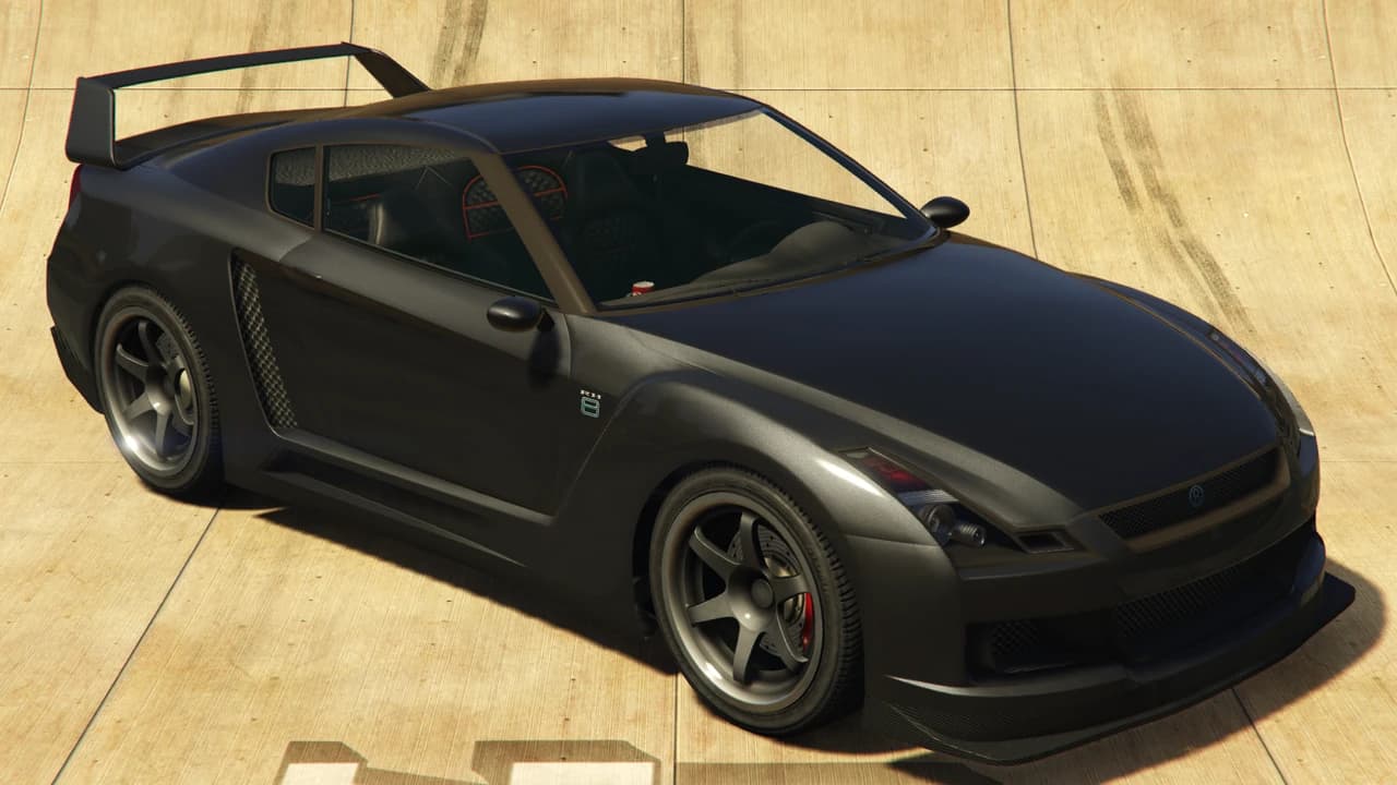 A dark grey Annis Elegy RH8 with a rear wing, front three-quarter view.