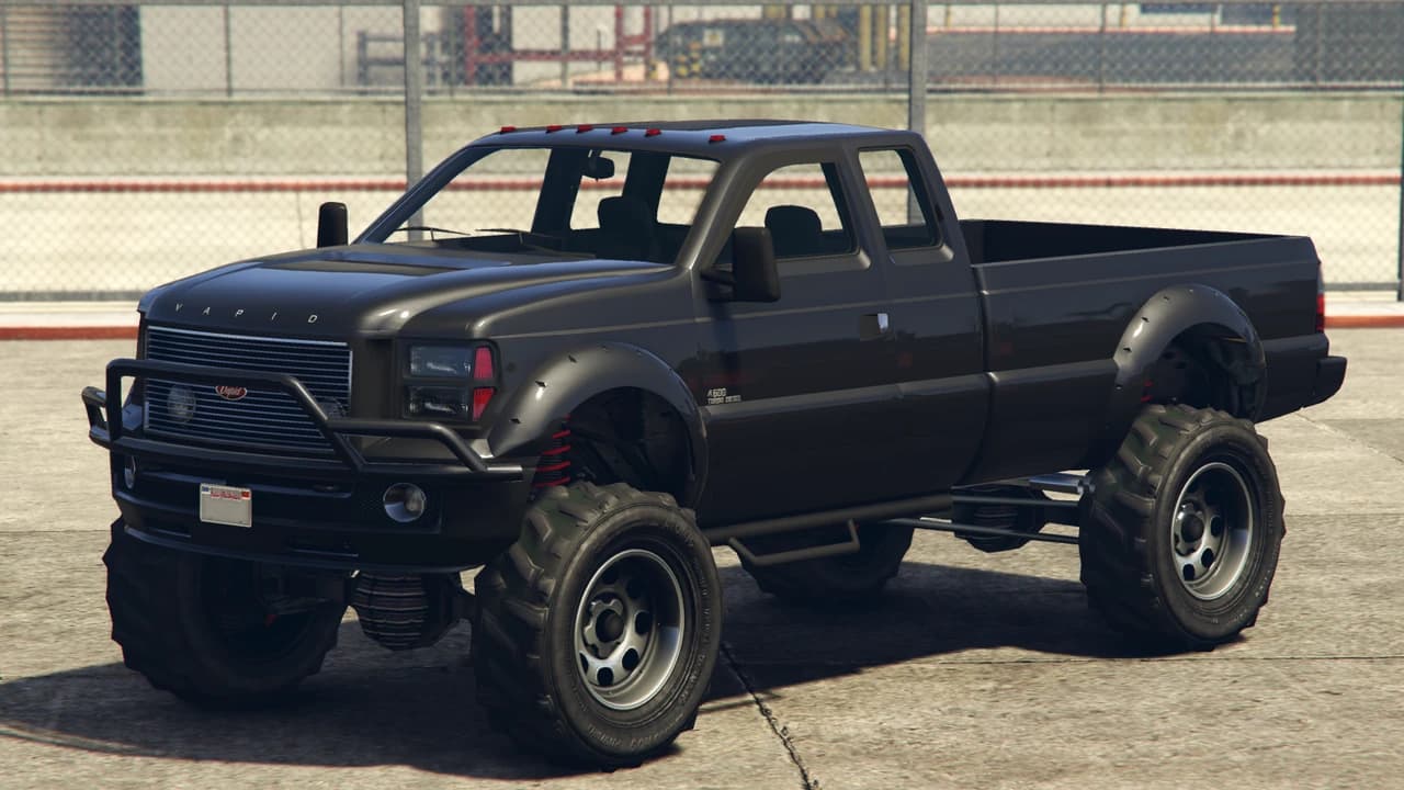 A black Vapid Sandking SWB with an extended cab and a short bed, front three-quarter view.