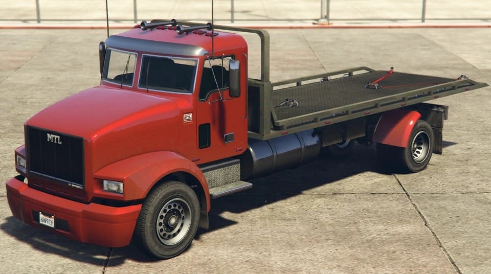A red MTL Flatbed recovery truck with MTL lettering across the grille, front three-quarter view.
