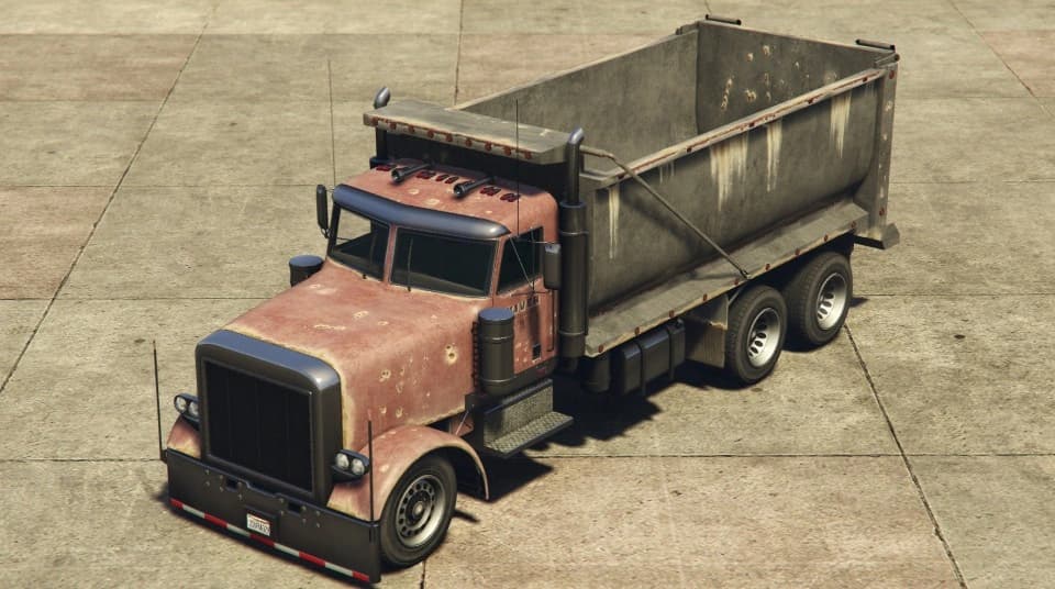 A faded red JoBuilt Rubble tipper truck, front three-quarter view.