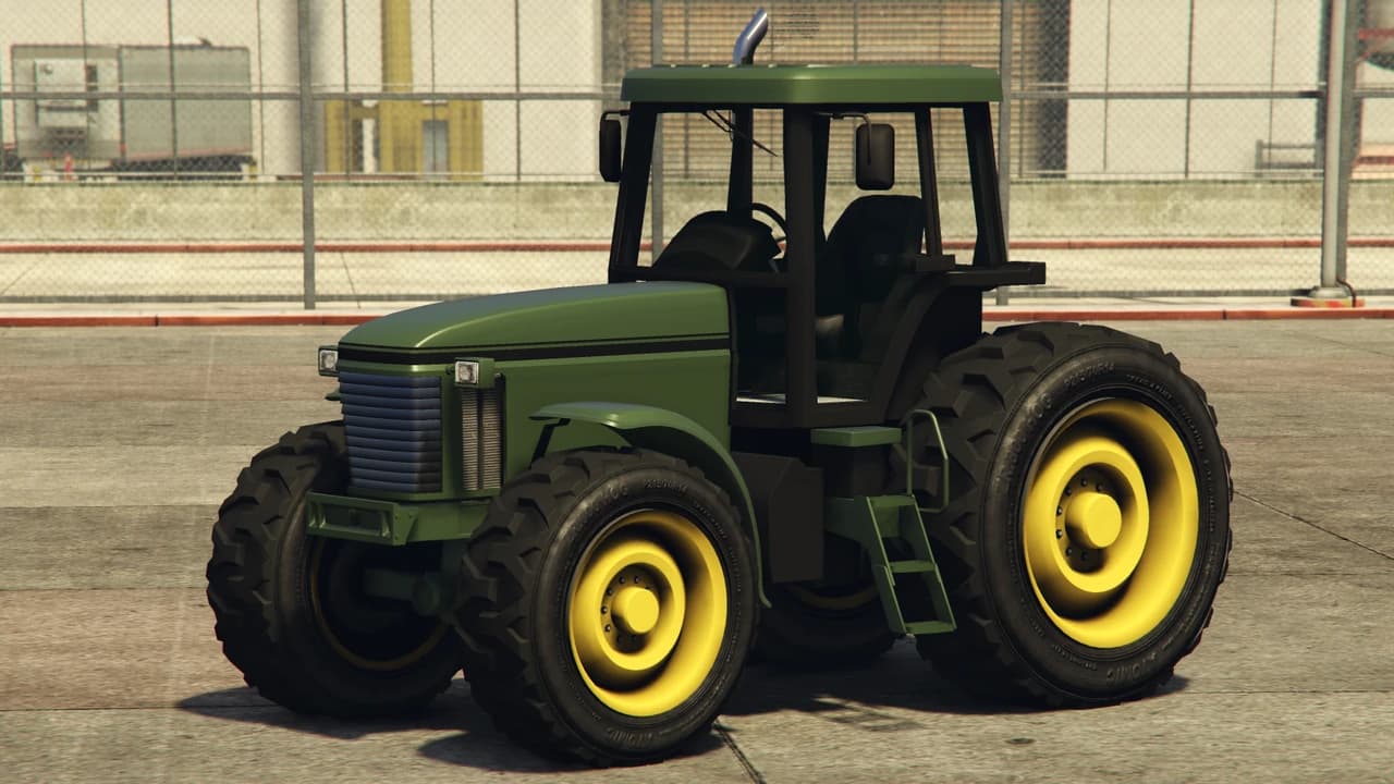 A green Stanley Fieldmaster tractor with yellow wheels, front three-quarter view.