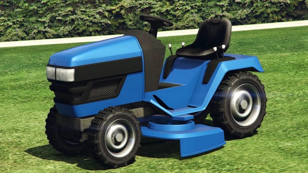 A blue Lawn Mower on grass, front three-quarter view.