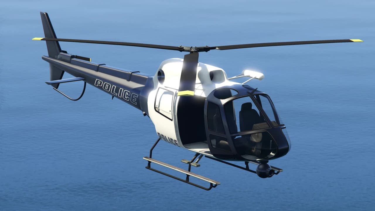 A black and white Police Maverick in flight over water, with POLICE lettering along the tail boom.