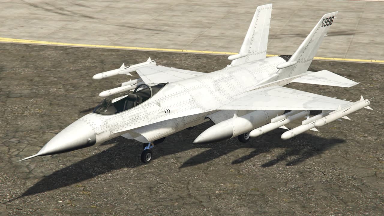A white P-996 LAZER fighter jet with wingtip and underwing missiles, standing on a taxiway.