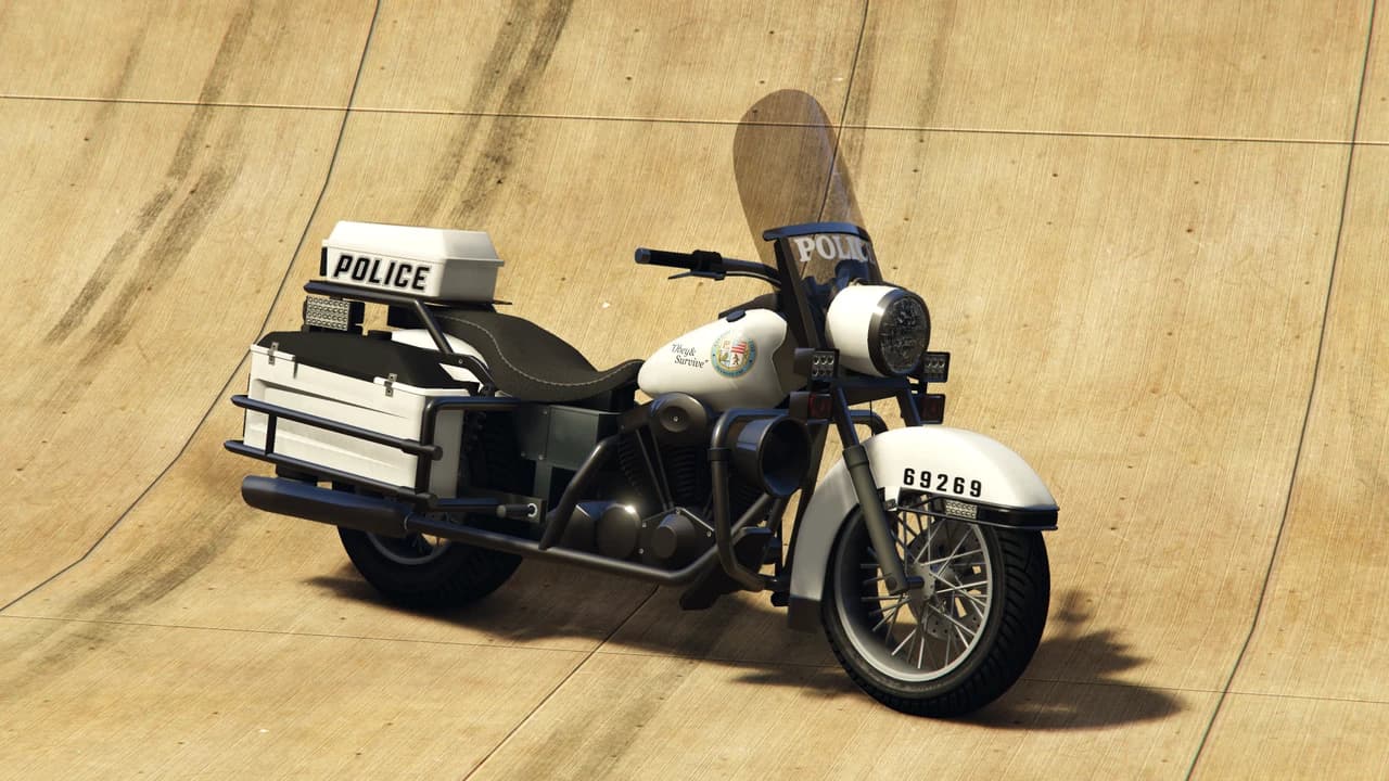 A white and black Police Bike with panniers, a windshield and a POLICE top box, front three-quarter view.