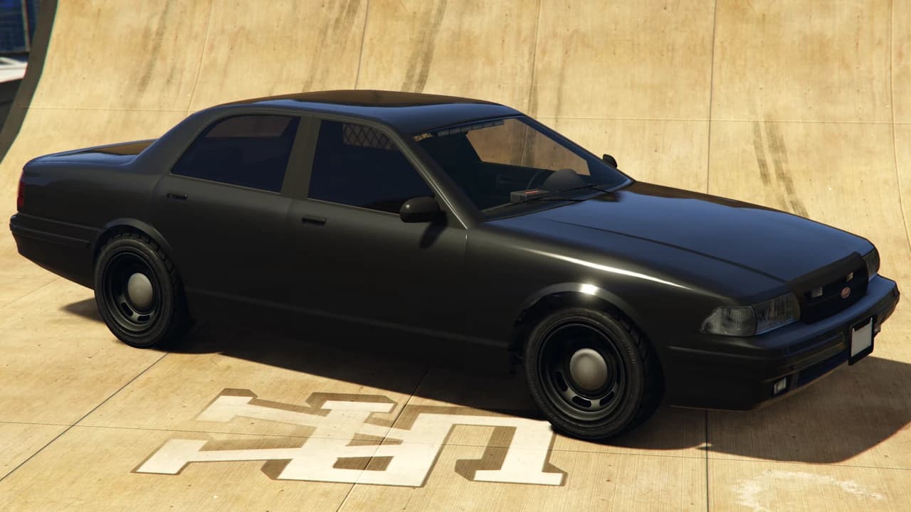 A black unmarked Vapid police cruiser with a cabin light bar and a prisoner screen, front three-quarter view.