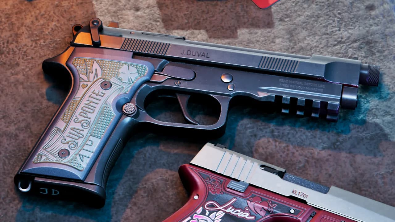 Jason's personalised Girardi ES9 pistol, engraved "J.DUVAL" on the slide with an ornate engraved grip, lying on stone; the edge of Lucia's red pistol is in the lower corner, in GTA VI.