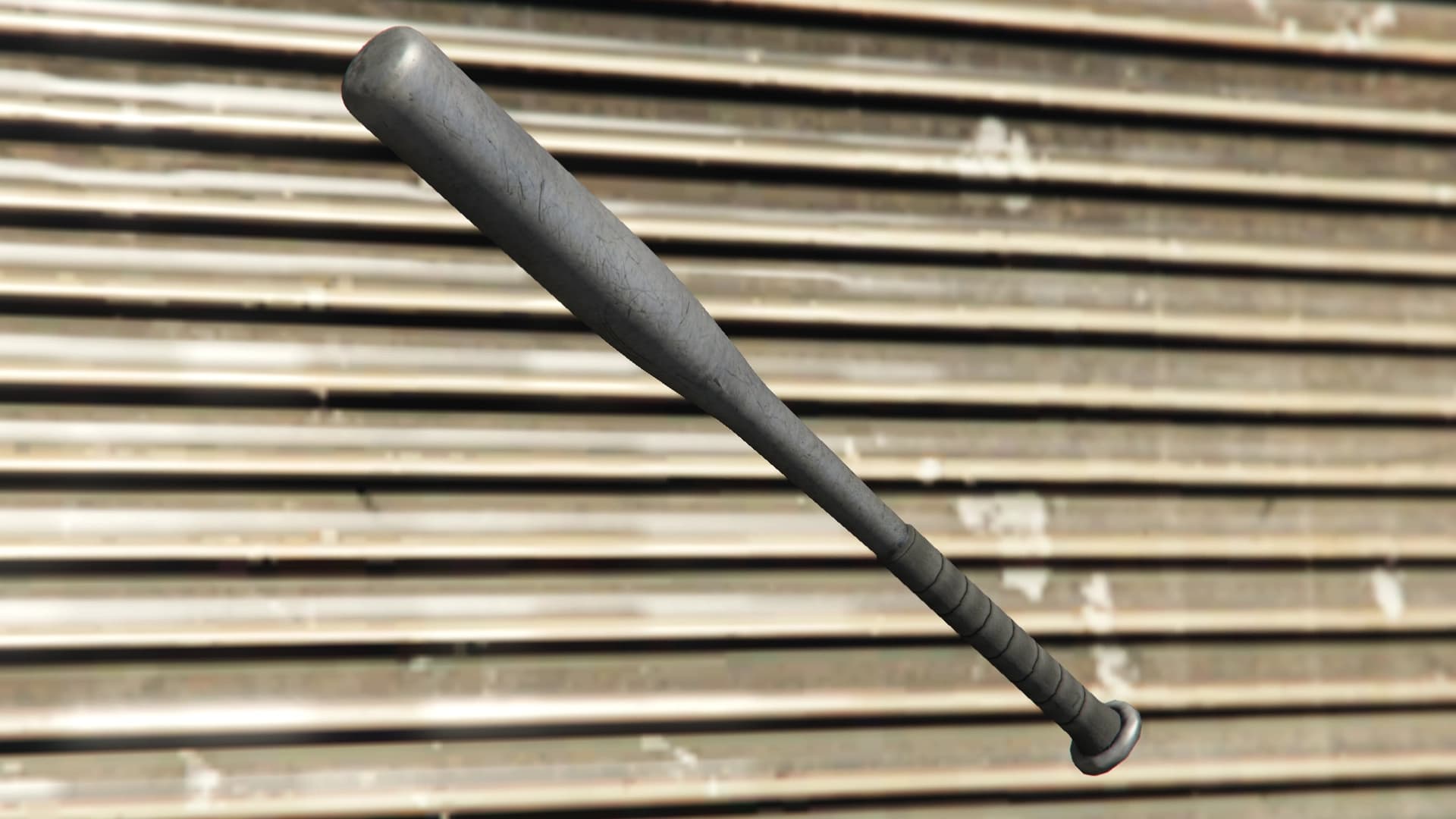 The GTA V baseball bat: a scuffed grey metal bat with a wrapped grip, against a corrugated wall.