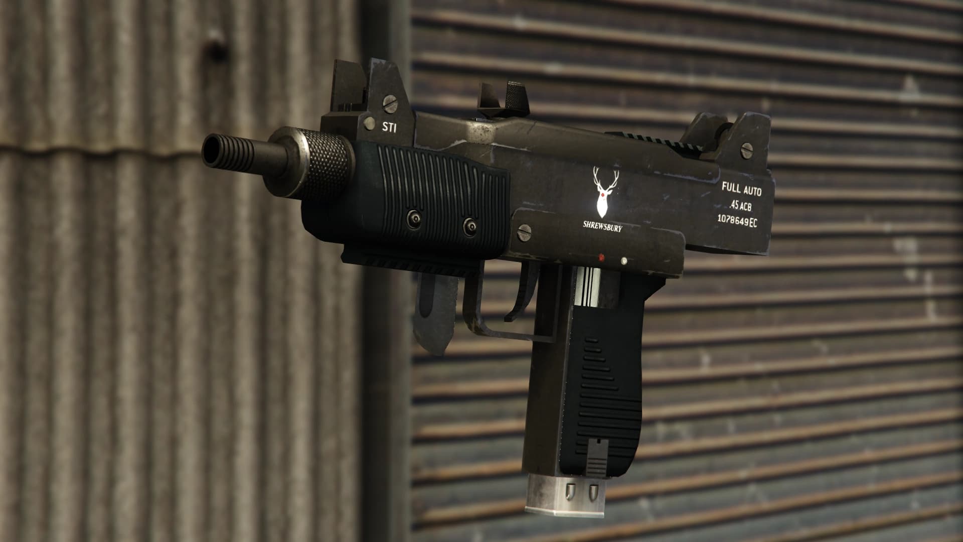 The GTA V Micro SMG: a black machine pistol with a Shrewsbury stag mark, stamped FULL AUTO and .45 ACB, against a corrugated wall.
